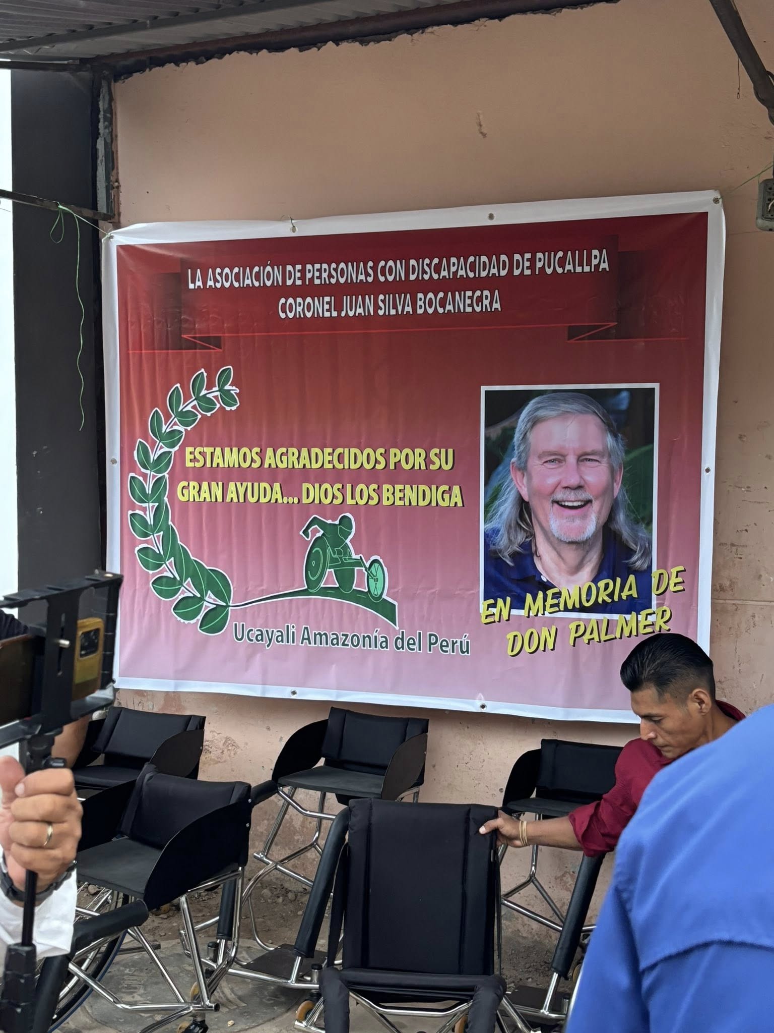 A sign the basketball team made in honor of Don Palmer. New wheelchairs under it.