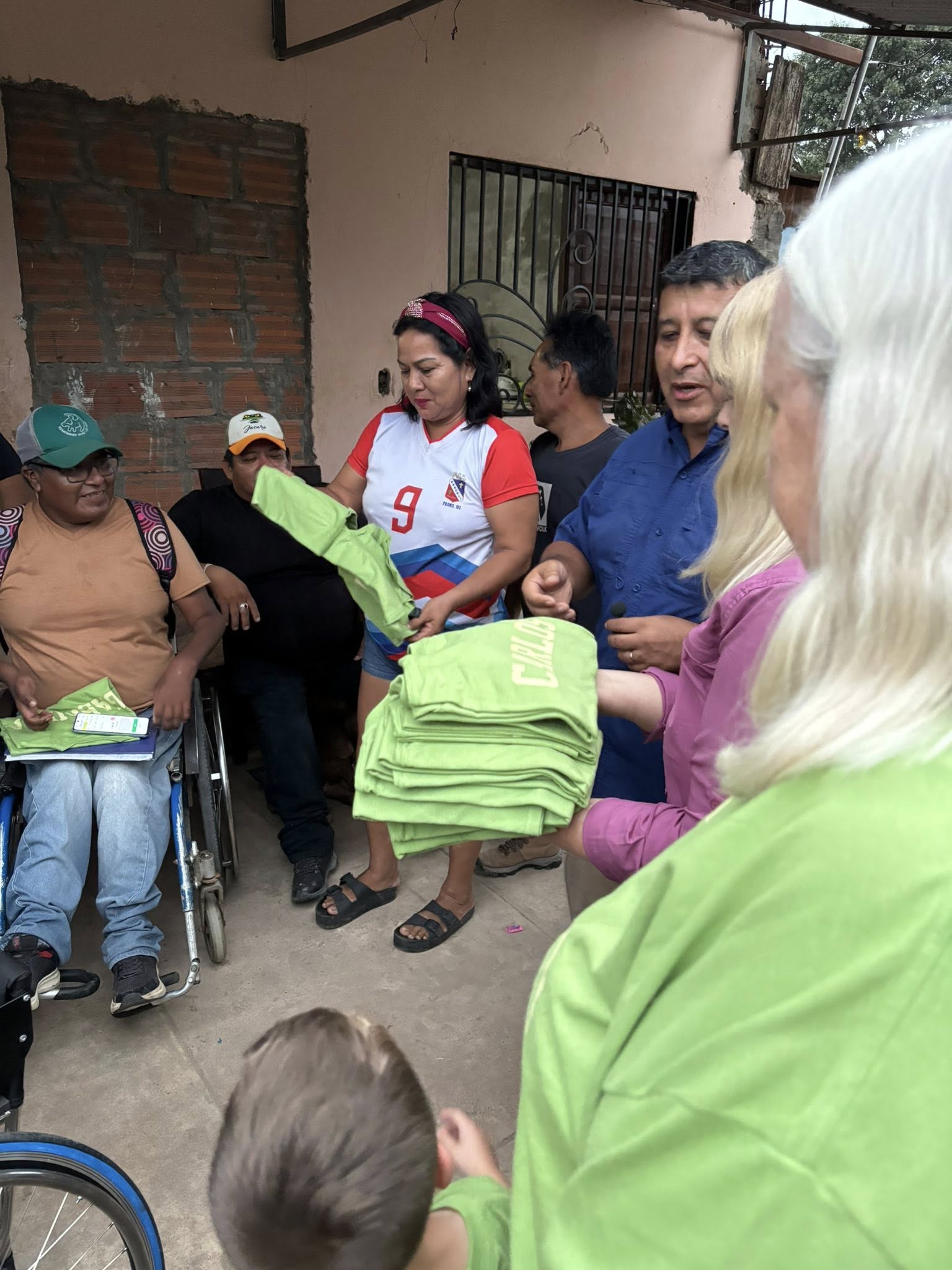 Don's family handing out team shirts they had made for them.