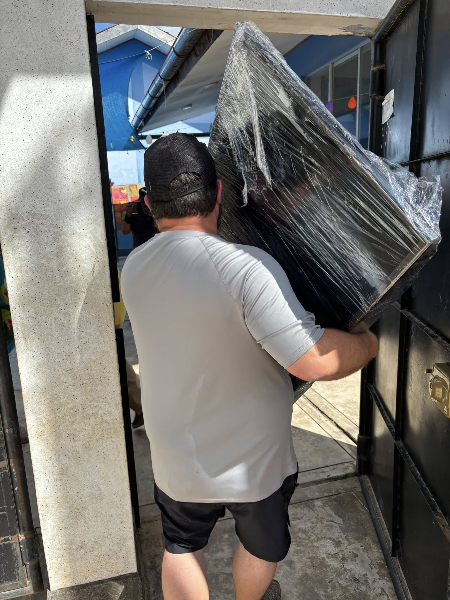 Delivering Juan and Kim's TV to school.