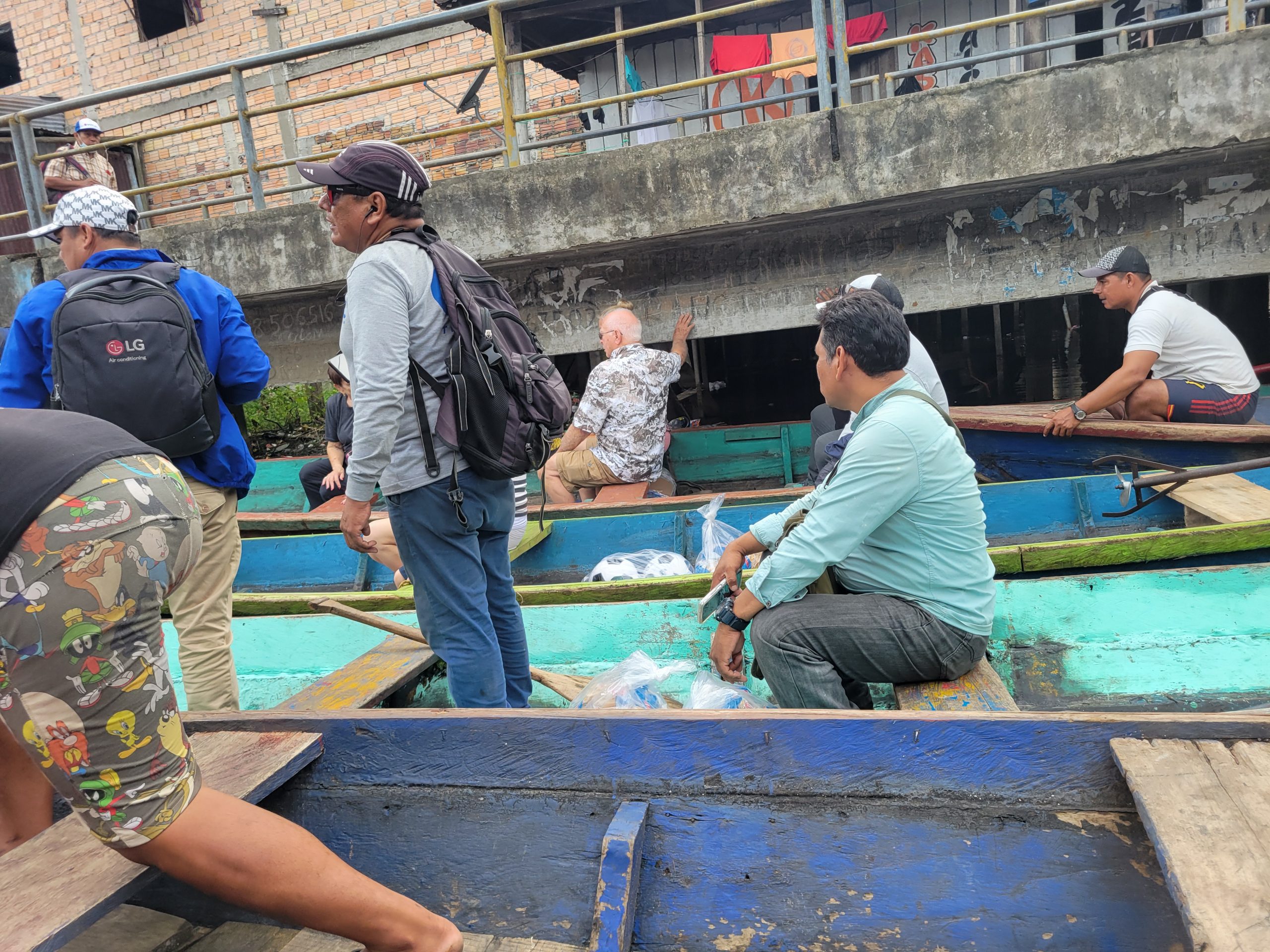 Climbing aboard the canoes.