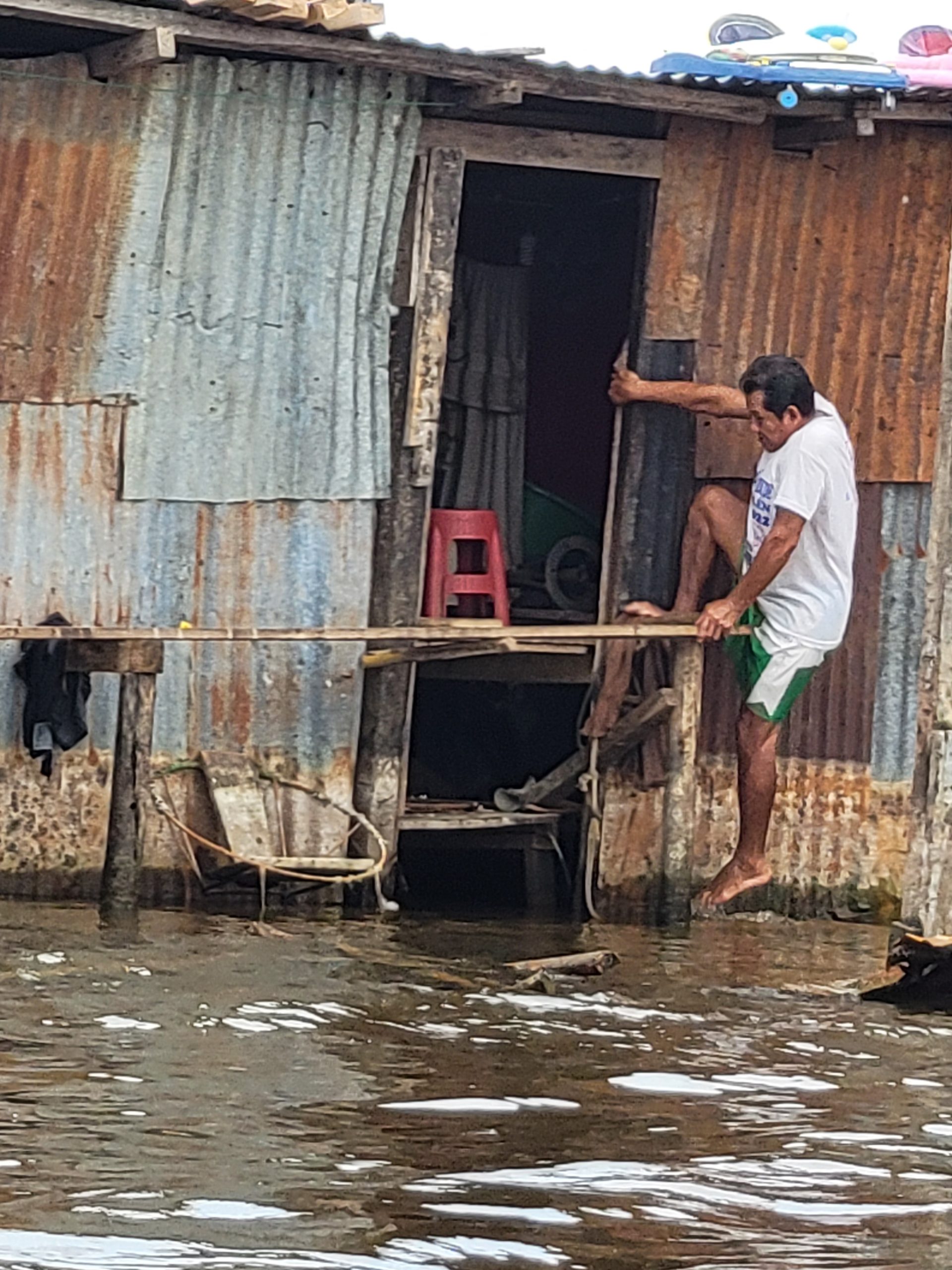 A gentlemen just finished washing up in river. 